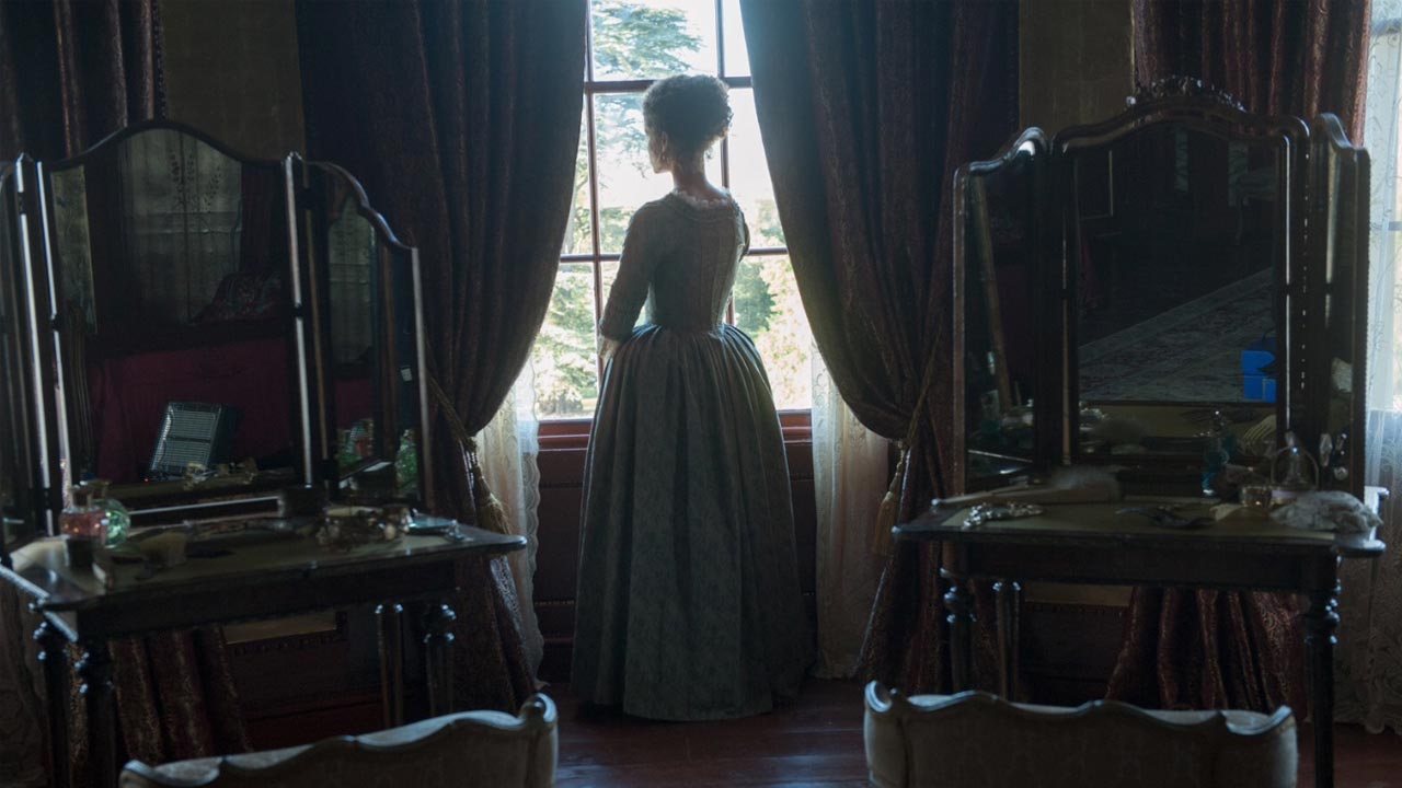 Screen shot of the Film Belle, with Belle looking out of the window